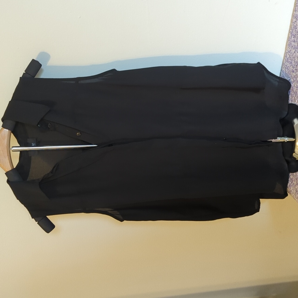 Black sleeveless button-down blouse
